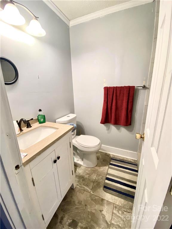 402 Brookgreen Drive Monroe, NC 28112 - Photo 18 of 26 a bathroom with a sink and mirror with toilet