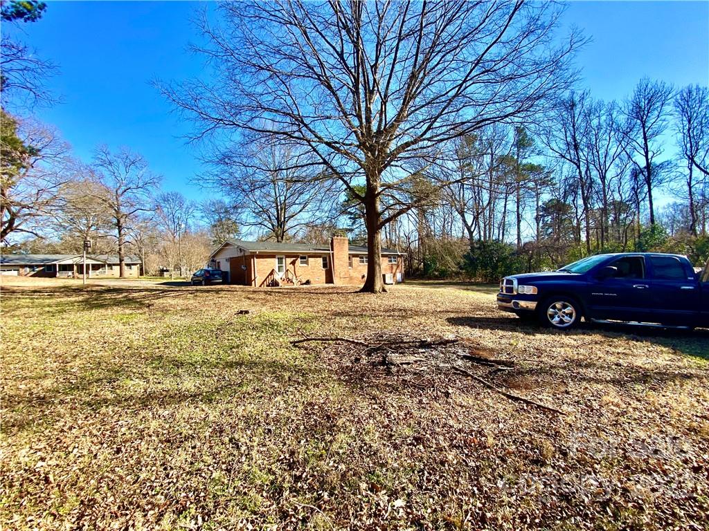 402 Brookgreen Drive Monroe, NC 28112 - Photo 24 of 26 a view of road with trees