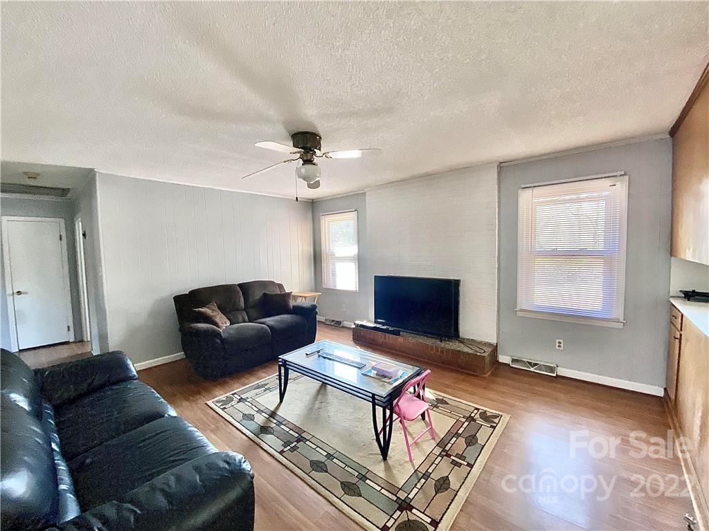 402 Brookgreen Drive Monroe, NC 28112 - Photo 8 of 26 a living room with furniture a rug and a window