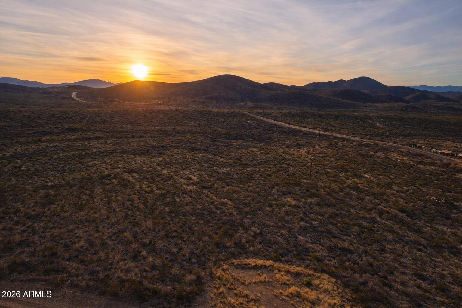 Tbd South Miners Dream Road Tombstone, AZ 85638 - Photo 12 of 23 a view of a mountain in the distance in a field