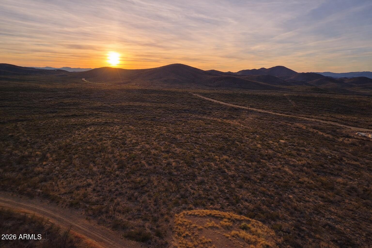 Tbd South Miners Dream Road Tombstone, AZ 85638 - Photo 13 of 23 a view of a mountain in the distance in a field