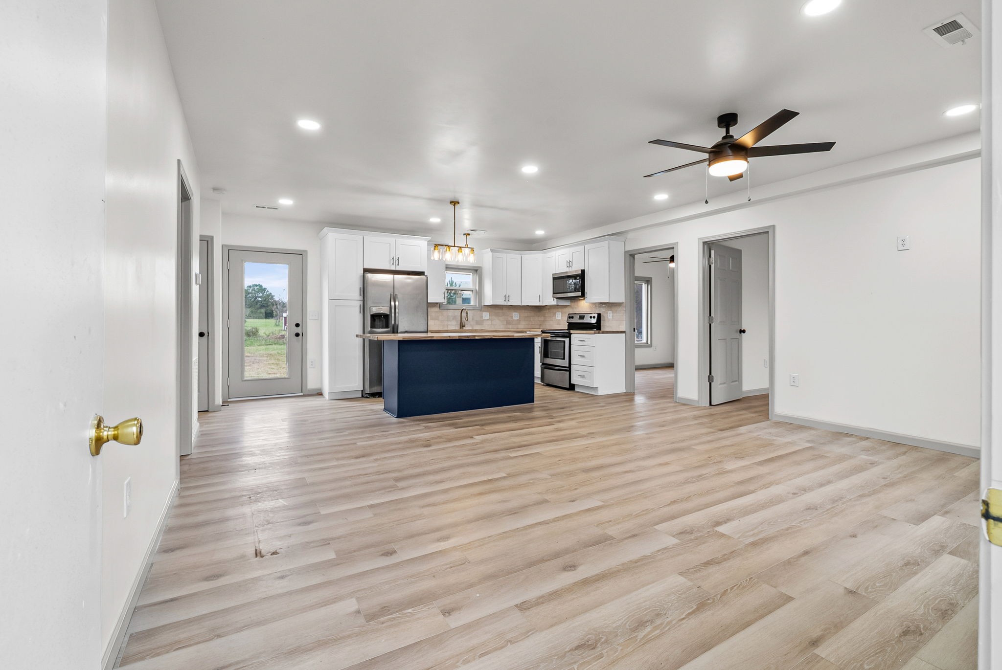 225 Military Road Herndon, KY 42236 - Photo 3 of 18 a view of a kitchen with a sink and a refrigerator