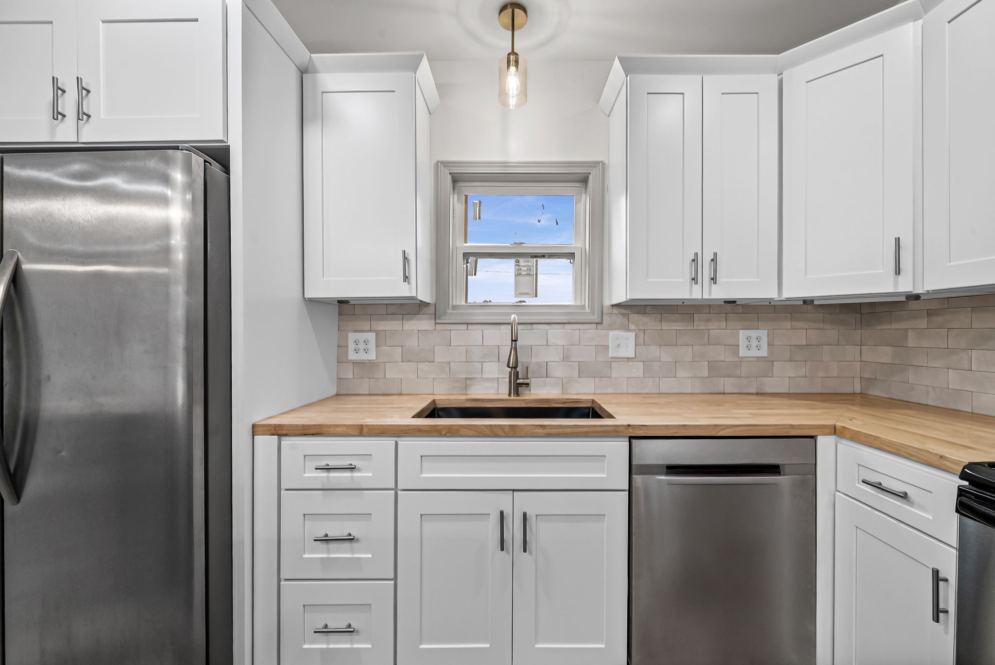 225 Military Road Herndon, KY 42236 - Photo 8 of 18 a kitchen with white cabinets and a sink