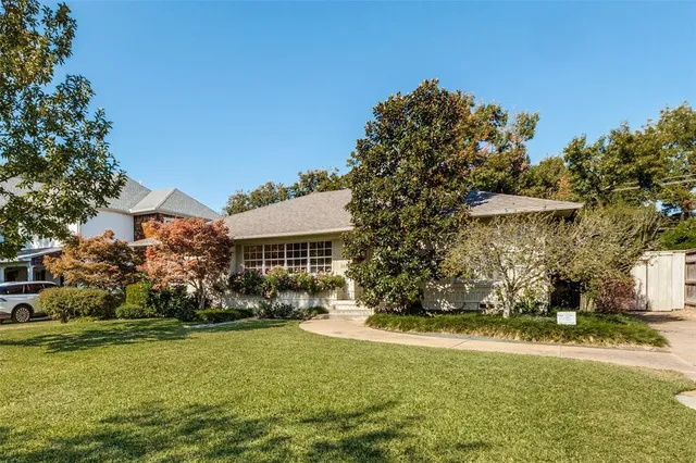 a front view of house with garden