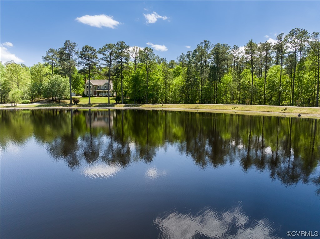 a view of a lake with houses in the background