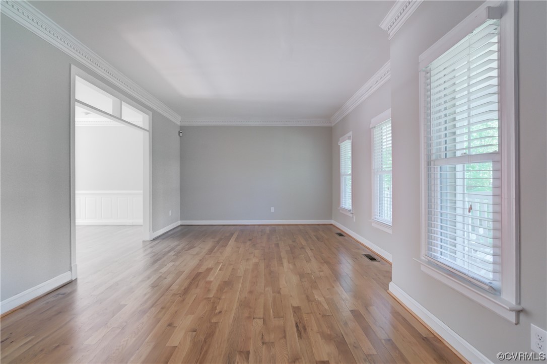 5101 Moseley Road Moseley, VA 23120 - Photo 13 of 46 a view of an empty room with wooden floor and a window