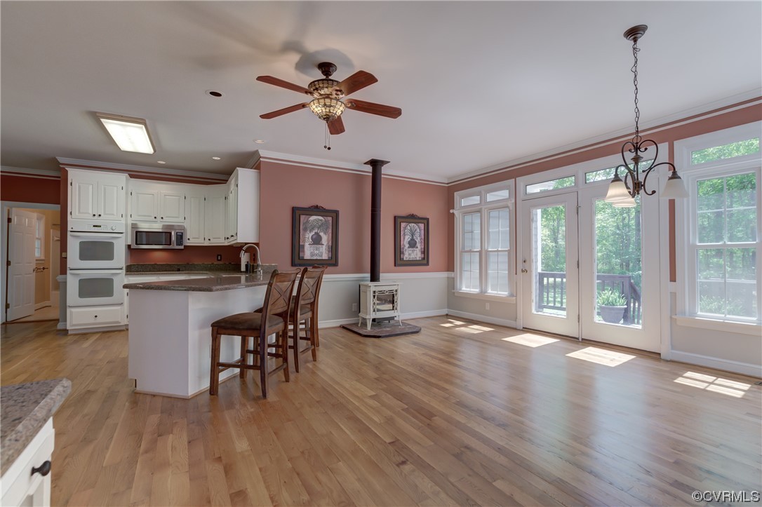 5101 Moseley Road Moseley, VA 23120 - Photo 17 of 46 a view of a dining room with furniture window and wooden floor