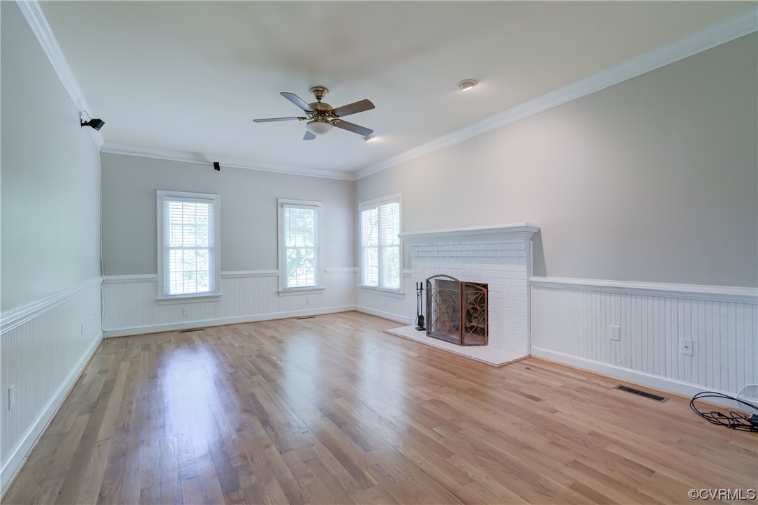 5101 Moseley Road Moseley, VA 23120 - Photo 19 of 46 a view of empty room with wooden floor and fireplace