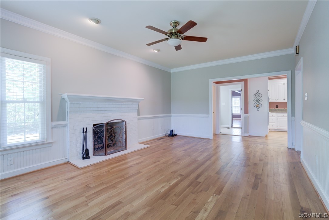 5101 Moseley Road Moseley, VA 23120 - Photo 20 of 46 an empty room with fireplace wooden floor and windows