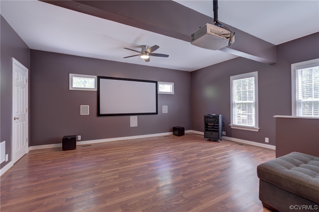 5101 Moseley Road Moseley, VA 23120 - Photo 21 of 46 a view of an empty room with window hardwood floor and a ceiling fan