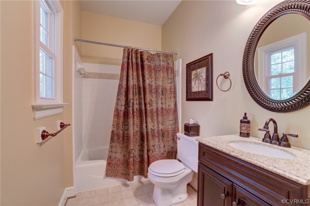 5101 Moseley Road Moseley, VA 23120 - Photo 22 of 46 a bathroom with a granite countertop sink mirror vanity and toilet
