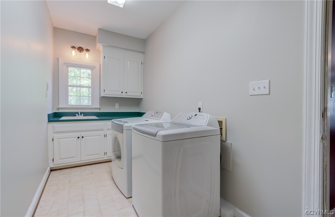 5101 Moseley Road Moseley, VA 23120 - Photo 23 of 46 a utility room with cabinets washer and dryer