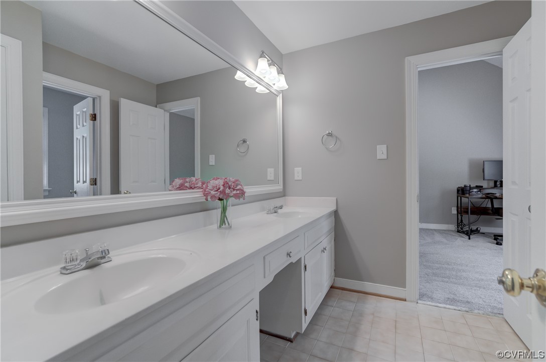 5101 Moseley Road Moseley, VA 23120 - Photo 31 of 46 a bathroom with a sink double vanity and a mirror