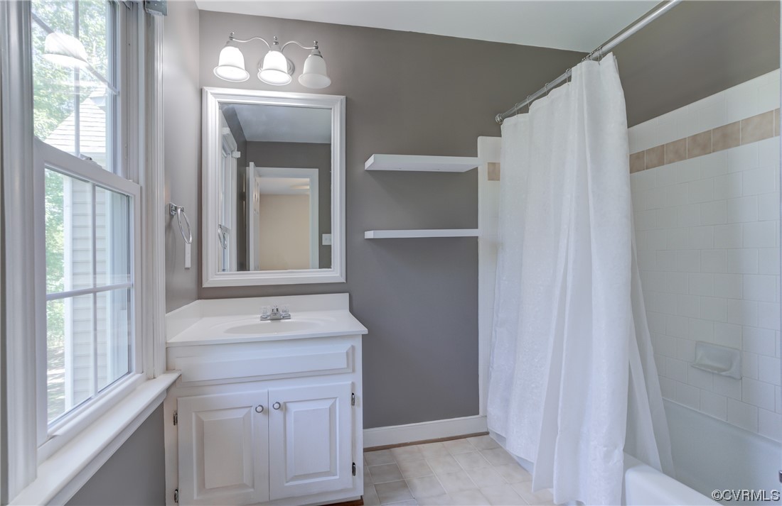 5101 Moseley Road Moseley, VA 23120 - Photo 35 of 46 a bathroom with a sink a mirror and a window