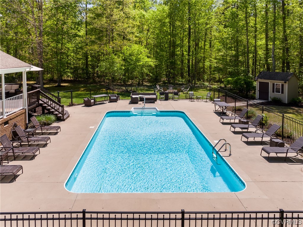5101 Moseley Road Moseley, VA 23120 - Photo 40 of 46 a view of a swimming pool with chairs
