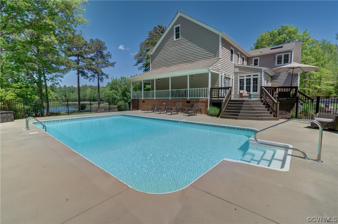 5101 Moseley Road Moseley, VA 23120 - Photo 10 of 46 a view of a house with pool and chairs in patio