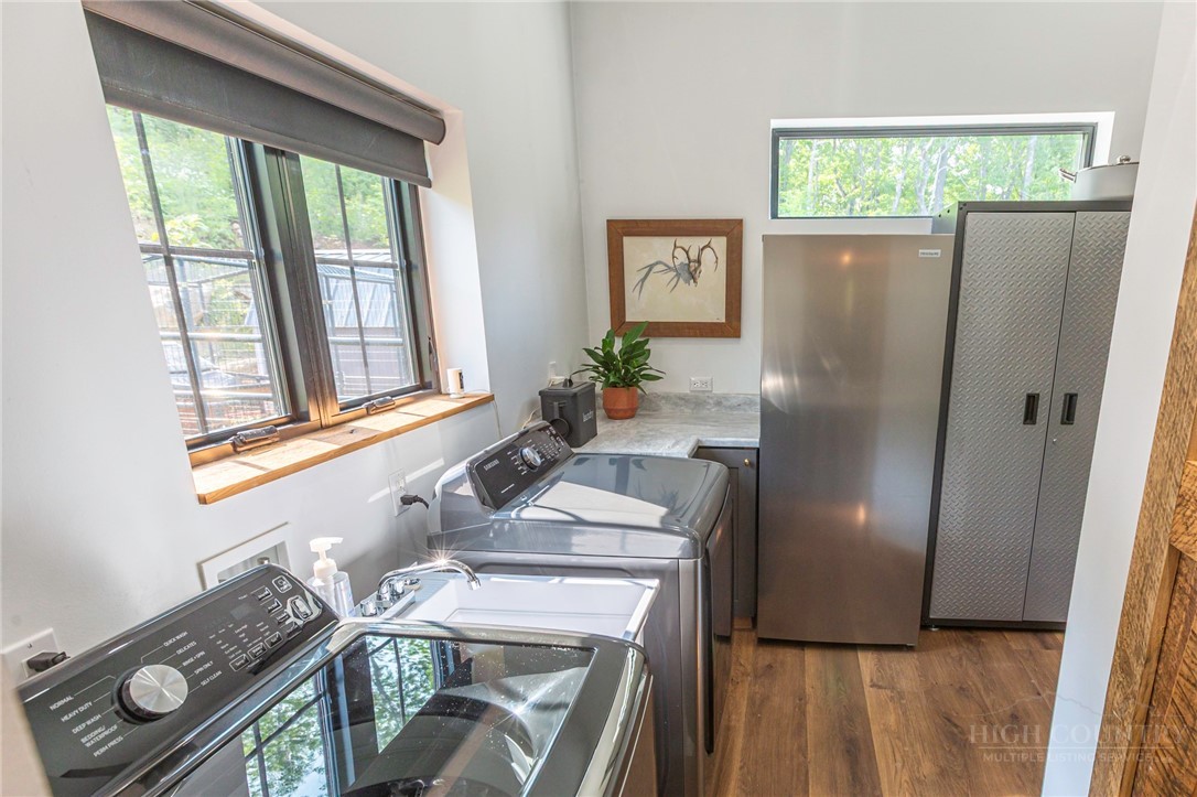 509 Grant Houck Road Todd, NC 28684 - Photo 27 of 43 a kitchen with a refrigerator and a window