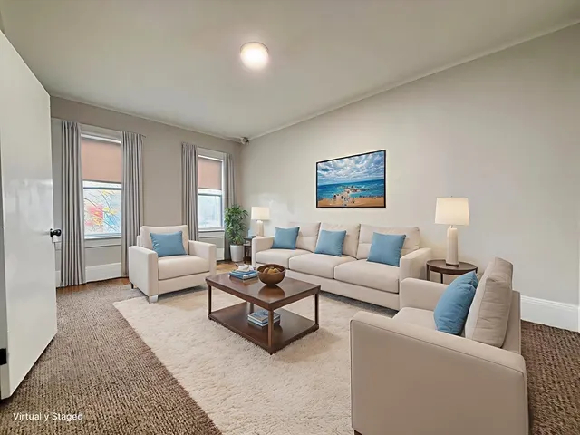 a living room with furniture and a couch