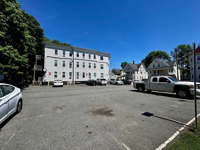 a view of a cars parked in front of a house