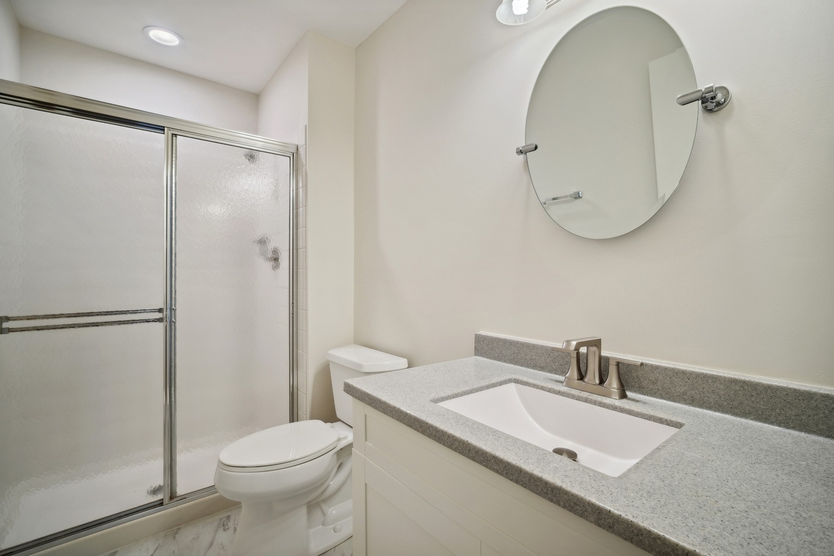 1419 Chippewa Trail Wheeling, IL 60090 - Photo 11 of 13 a bathroom with a sink a toilet and a mirror