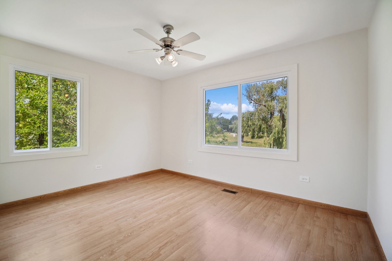 1419 Chippewa Trail Wheeling, IL 60090 - Photo 7 of 13 a view of an empty room with a window