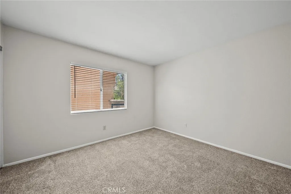 25118 Steinbeck Avenue Stevenson Ranch, CA 91381 - Photo 18 of 34 an empty room with a window