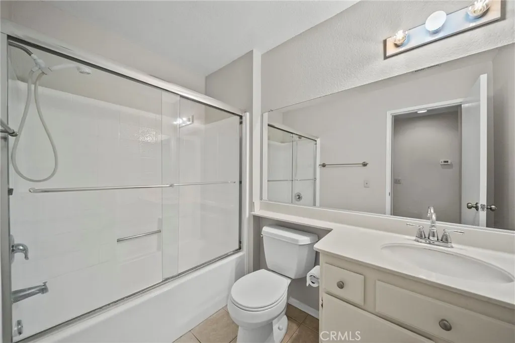 25118 Steinbeck Avenue Stevenson Ranch, CA 91381 - Photo 20 of 34 a bathroom with a sink a toilet and shower