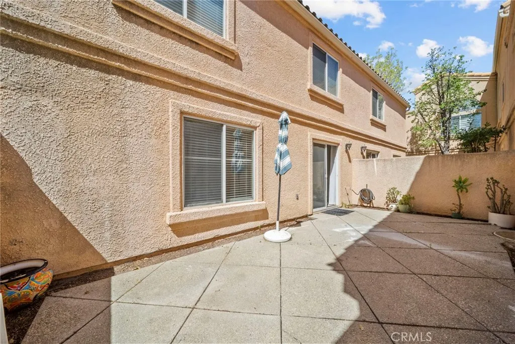 25118 Steinbeck Avenue Stevenson Ranch, CA 91381 - Photo 26 of 34 a view of a house with a door