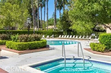 25118 Steinbeck Avenue Stevenson Ranch, CA 91381 - Photo 32 of 34 a view of a chair and table in the garden