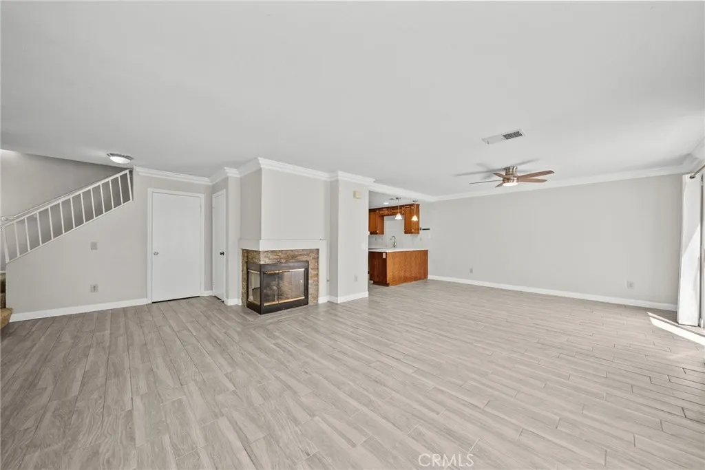 25118 Steinbeck Avenue Stevenson Ranch, CA 91381 - Photo 5 of 34 a view of empty room with wooden floor