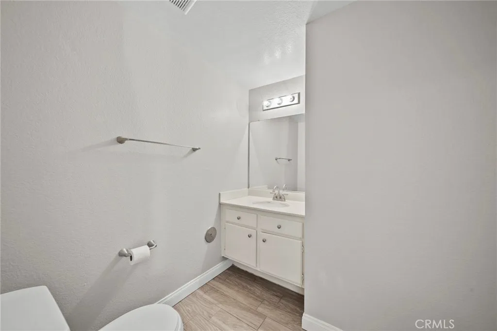 25118 Steinbeck Avenue Stevenson Ranch, CA 91381 - Photo 6 of 34 a bathroom with a toilet sink and mirror