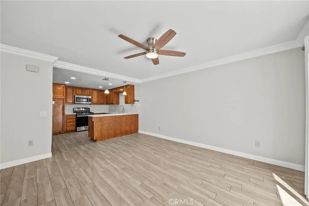 25118 Steinbeck Avenue Stevenson Ranch, CA 91381 - Photo 10 of 34 a view of kitchen with wooden floor