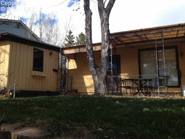 6965 Chippewa Road Colorado Springs, CO 80915 - Photo 29 of 31 Patio area with the workshop/shed on the left.