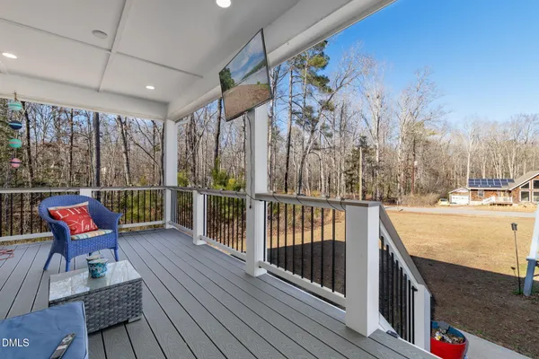a view of a balcony with chairs