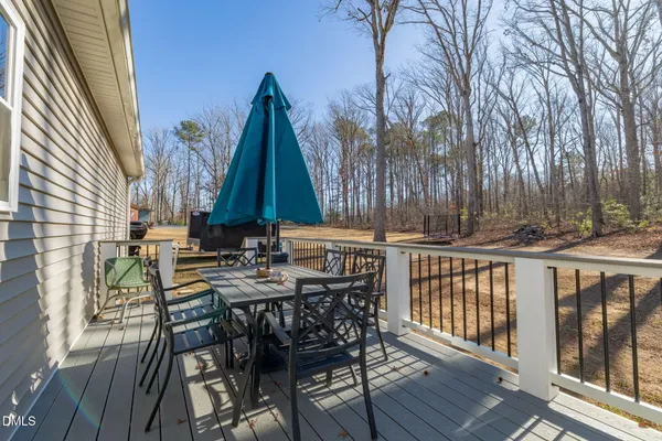a view of a chairs and table in patio