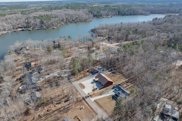 an aerial view of a house with a lake view