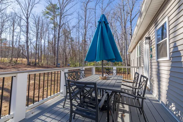 a view of deck with patio table and chairs