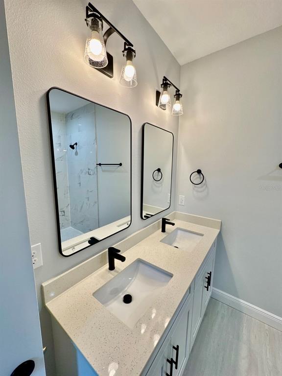 1683 Southwest 3rd Street Ocala, FL 34471 - Photo 11 of 13 a bathroom with a sink and a mirror