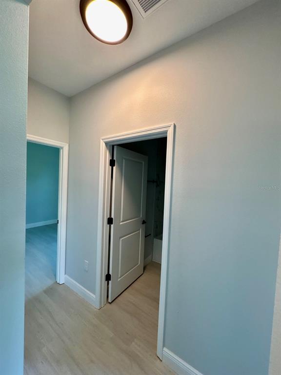 1683 Southwest 3rd Street Ocala, FL 34471 - Photo 3 of 13 a view of a kitchen cabinets and wooden floor