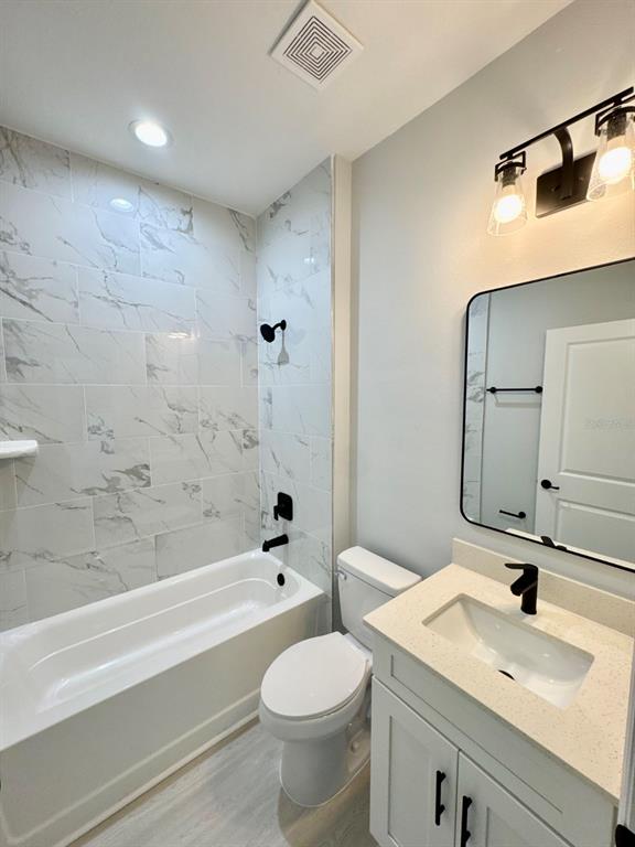 1683 Southwest 3rd Street Ocala, FL 34471 - Photo 4 of 13 a bathroom with a sink toilet and shower