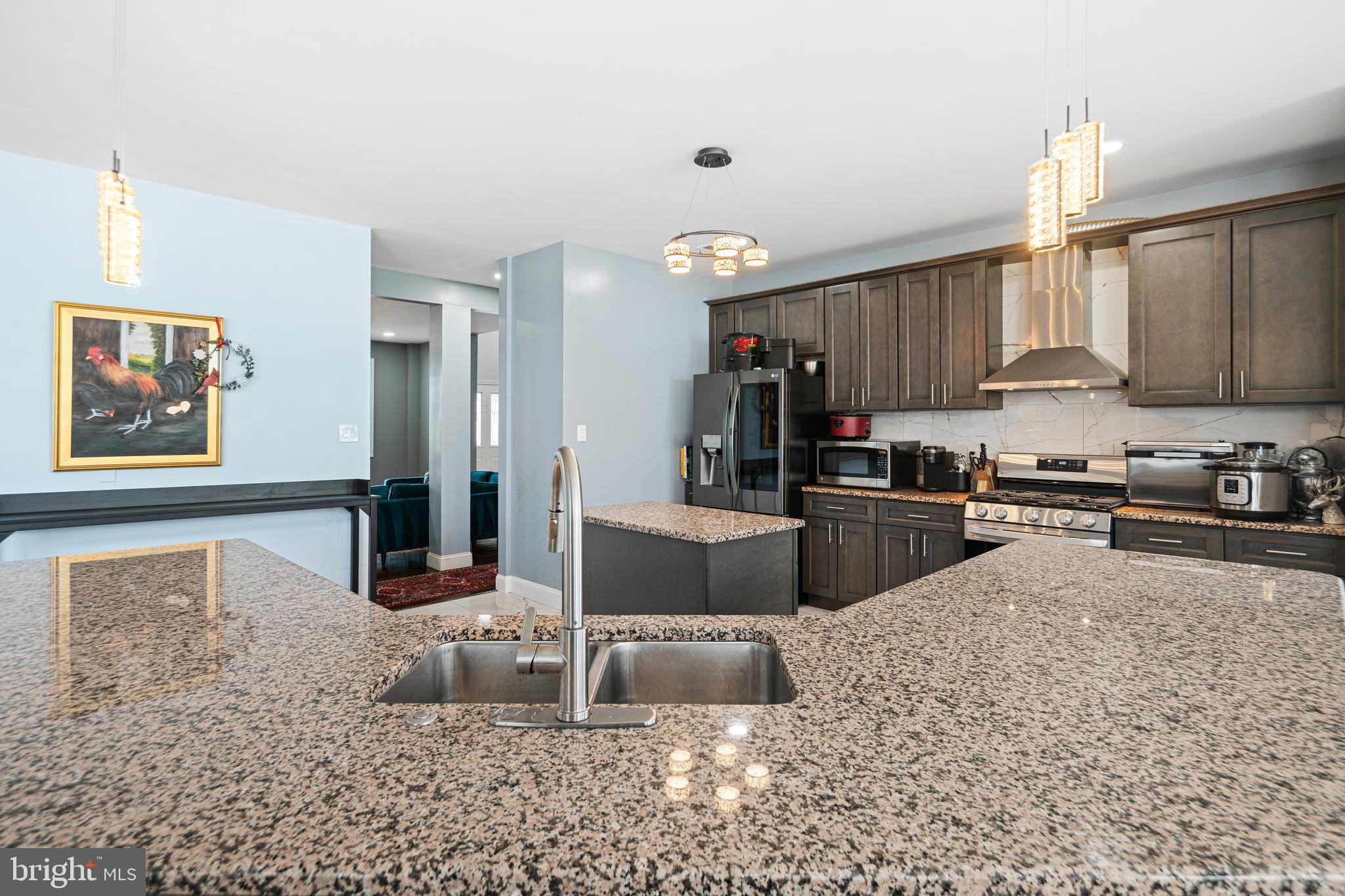 52 River Run Lawnside, NJ 08045 - Photo 11 of 49 a kitchen with stainless steel appliances granite countertop a stove refrigerator and a sink
