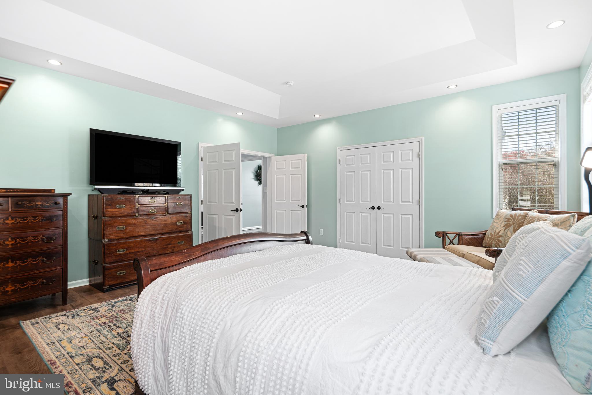 52 River Run Lawnside, NJ 08045 - Photo 22 of 49 a bedroom with a bed and a flat screen tv