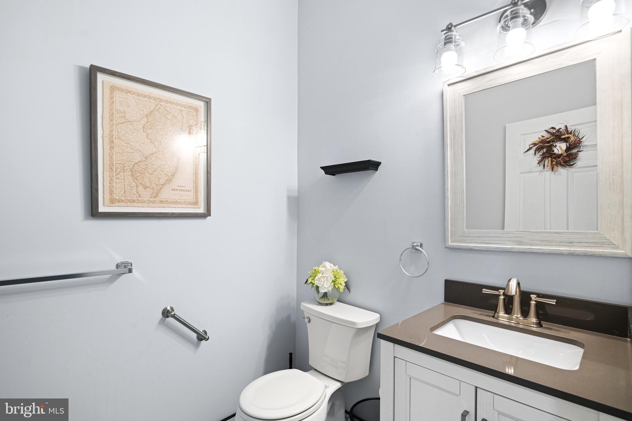 52 River Run Lawnside, NJ 08045 - Photo 26 of 49 a bathroom with a toilet sink and mirror