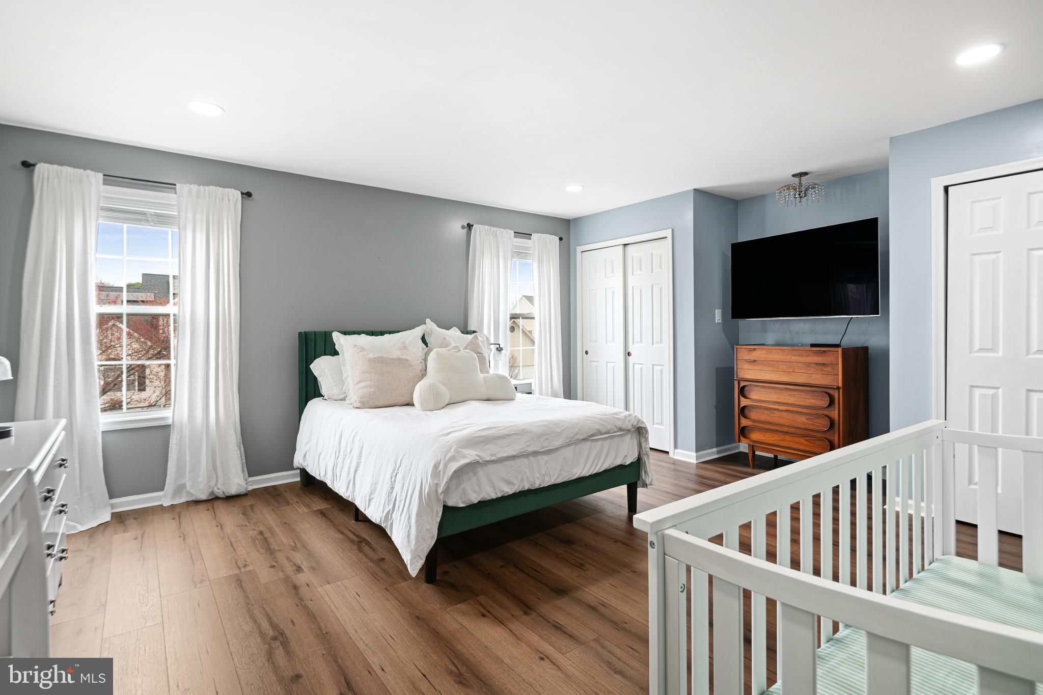 52 River Run Lawnside, NJ 08045 - Photo 35 of 49 a bedroom with a bed and a flat screen tv