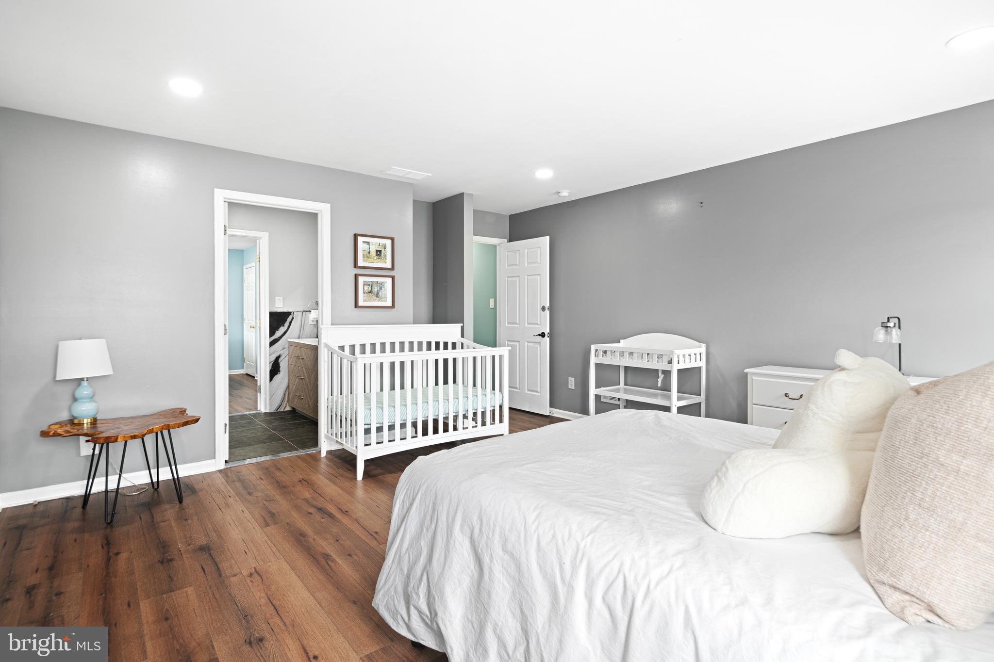 52 River Run Lawnside, NJ 08045 - Photo 36 of 49 a bedroom with a bed and a chair