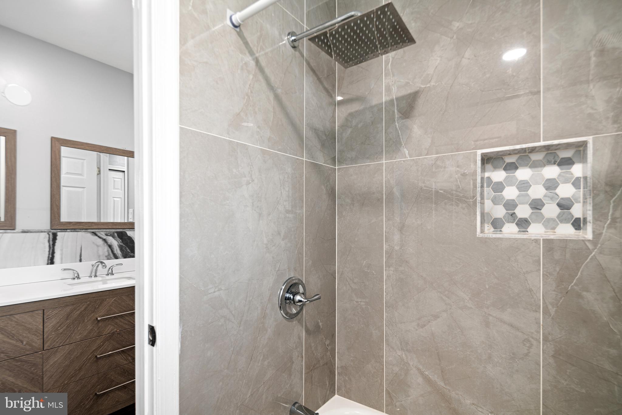 52 River Run Lawnside, NJ 08045 - Photo 37 of 49 a bathroom with a sink and shower