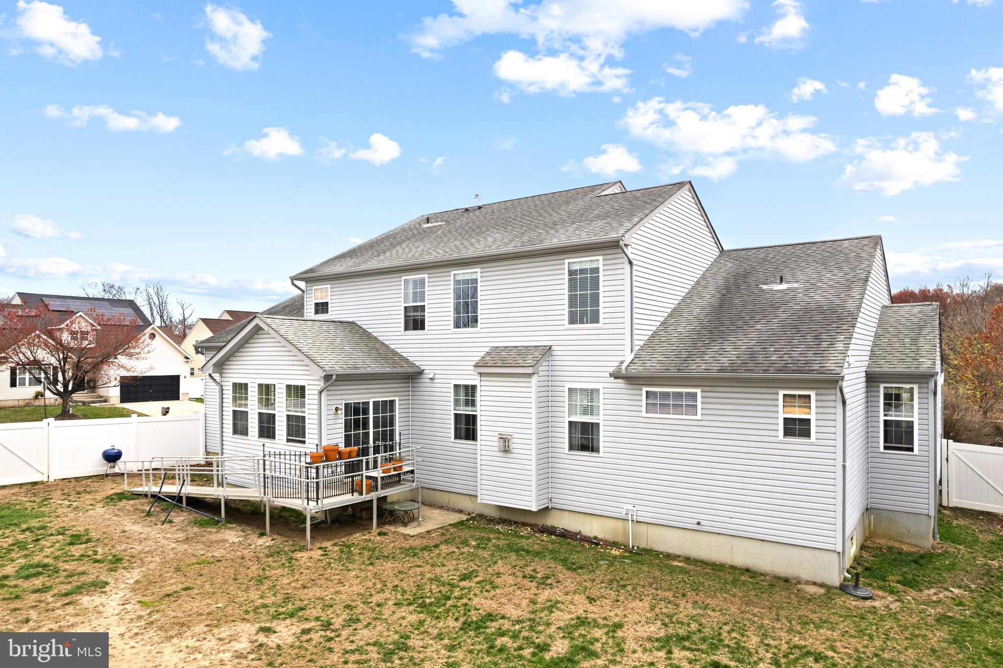 52 River Run Lawnside, NJ 08045 - Photo 40 of 49 a white house that has a table and chairs in it