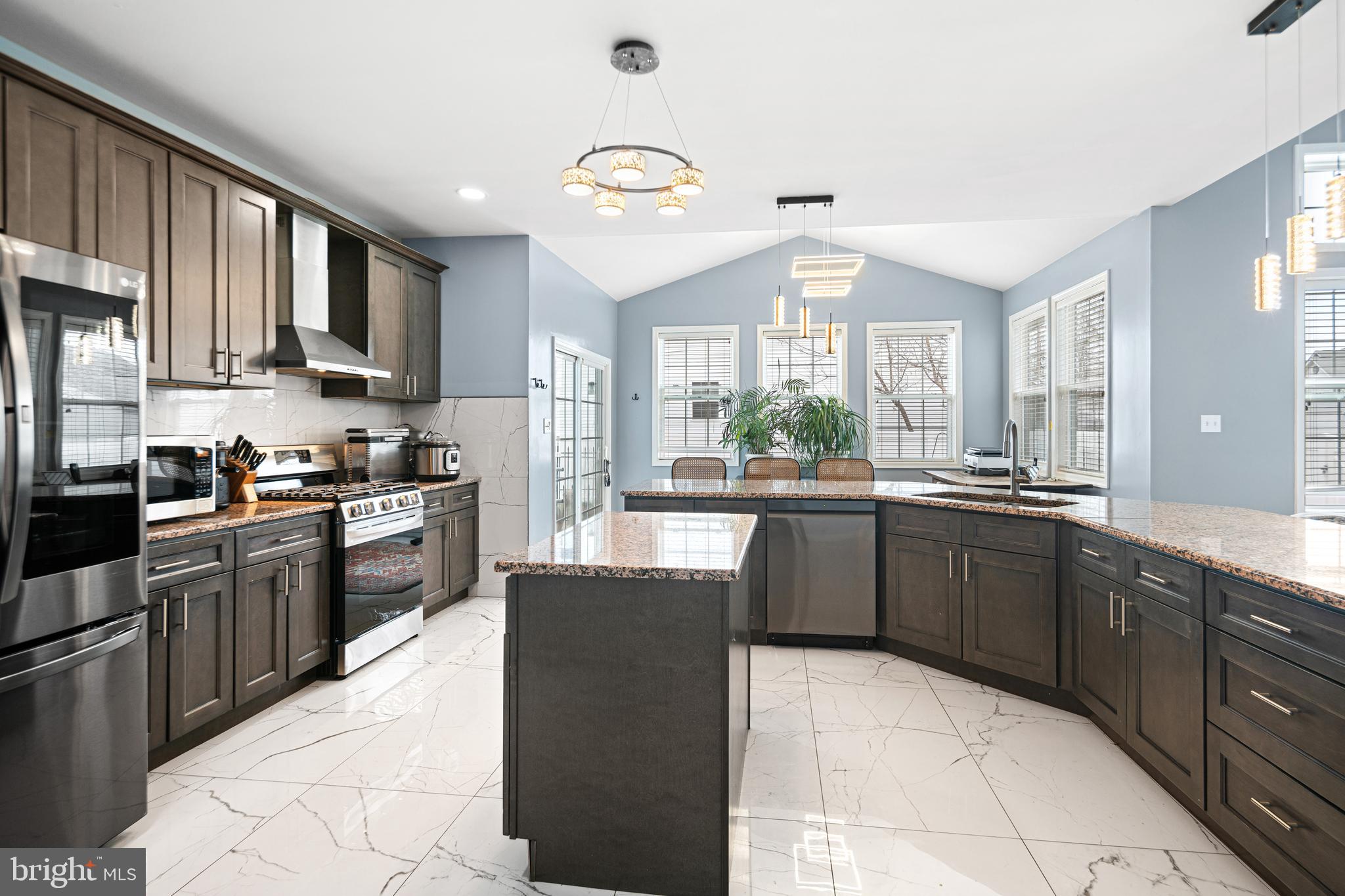 52 River Run Lawnside, NJ 08045 - Photo 7 of 49 a kitchen with stainless steel appliances granite countertop a stove sink and cabinets