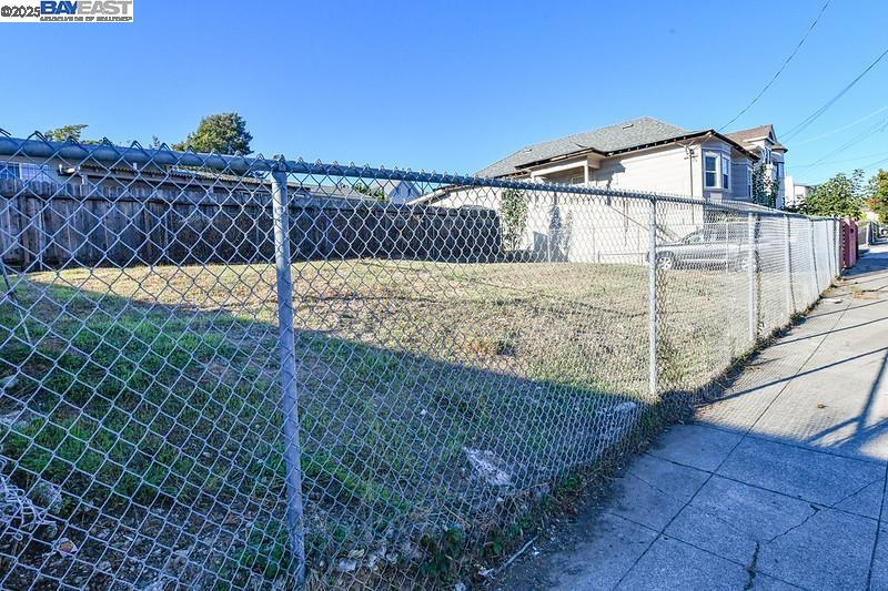 2409 25th Avenue Oakland, CA 94601 - Photo 3 of 5 a view of a house with a small yard and wooden fence