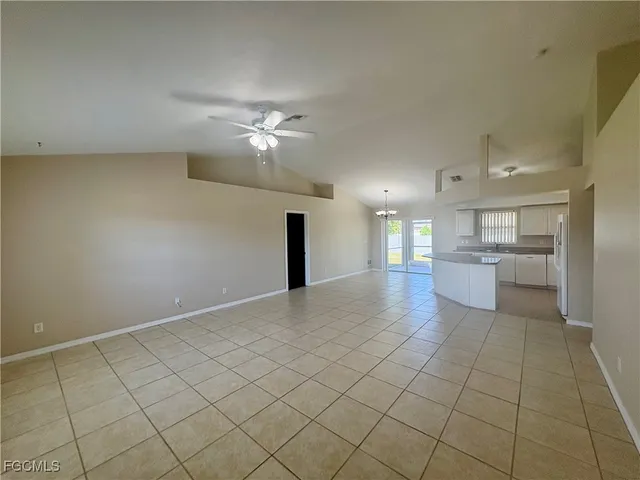 a view of a kitchen with a sink and a chandelier
